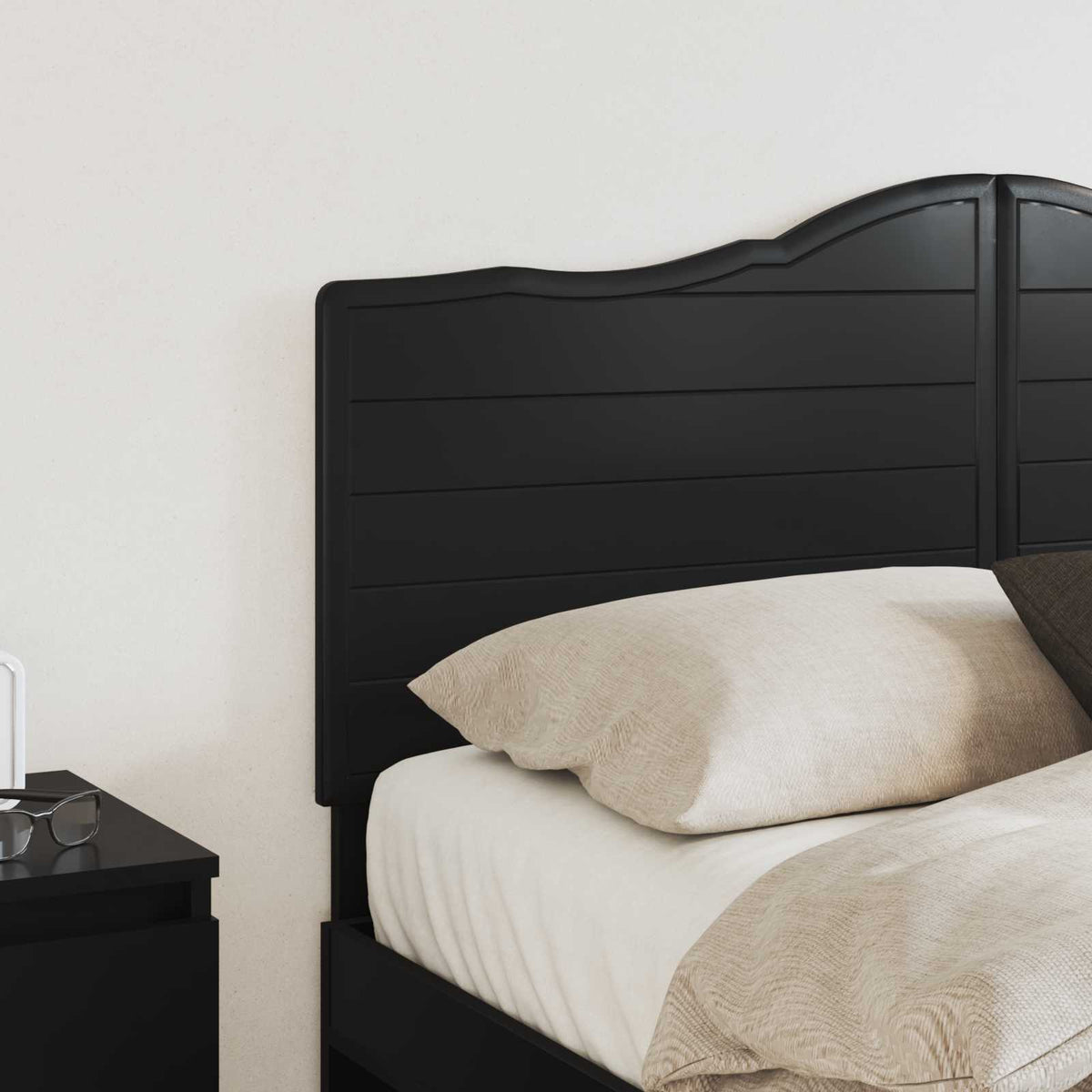 Close-up of the black oak engineered wood headboard showing its textured surface