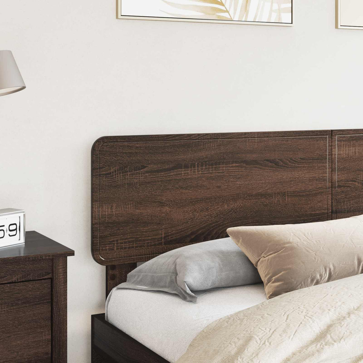 The brown oak headboard attached to a bed in a bedroom setting