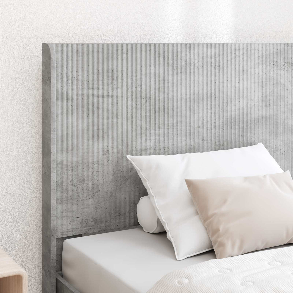 Close up of the concrete grey engineered wood headboard on a bed