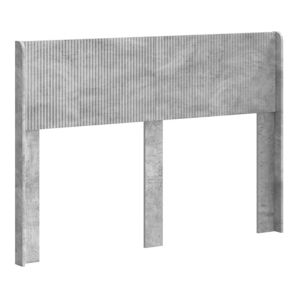 The headboard with a textured ribbed panel design and three vertical support legs