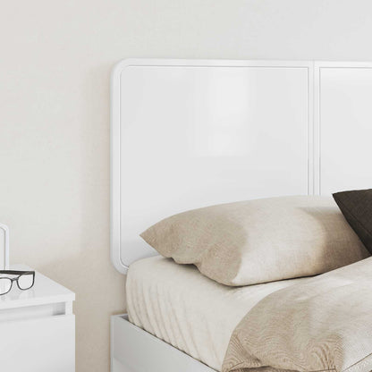 the white headboard in a bedroom setting, next to a bedside table