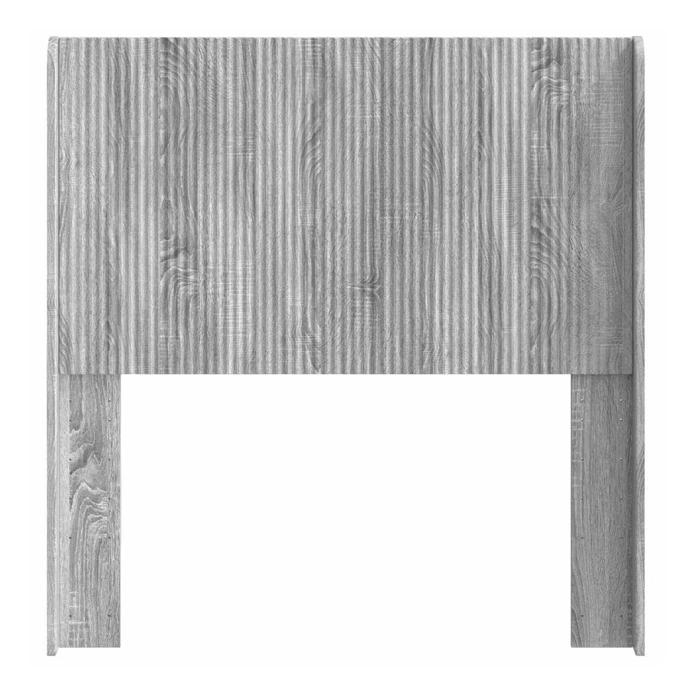 the headboard viewed from the front showing the vertical ribbed design and wood texture