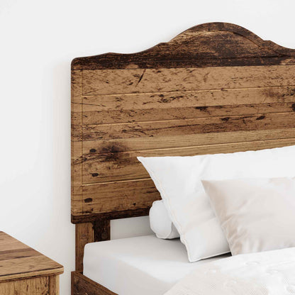 Close-up of the rustic wood effect finish on the headboard attached to a bed