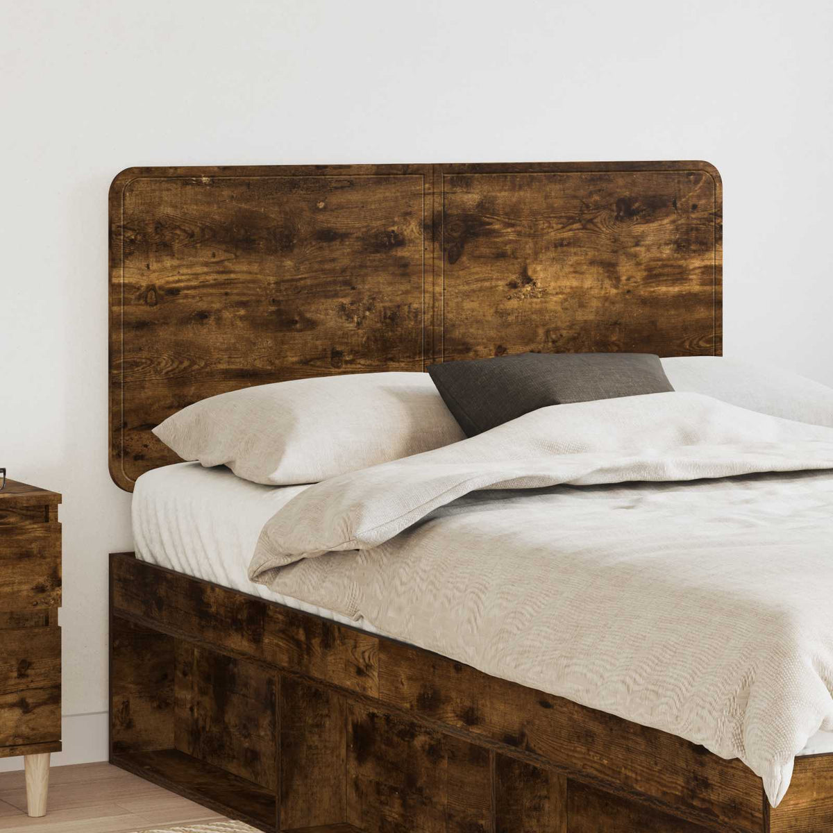 vidaXL Headboard Smoked Oak Engineered wood mounted behind a bed in a bedroom setting
