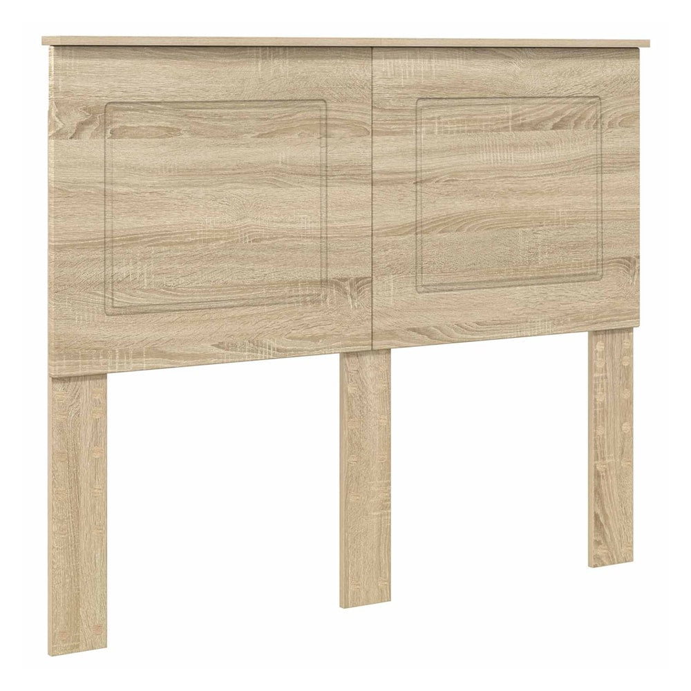 The headboard has a light wood effect finish with two recessed panel details on the front