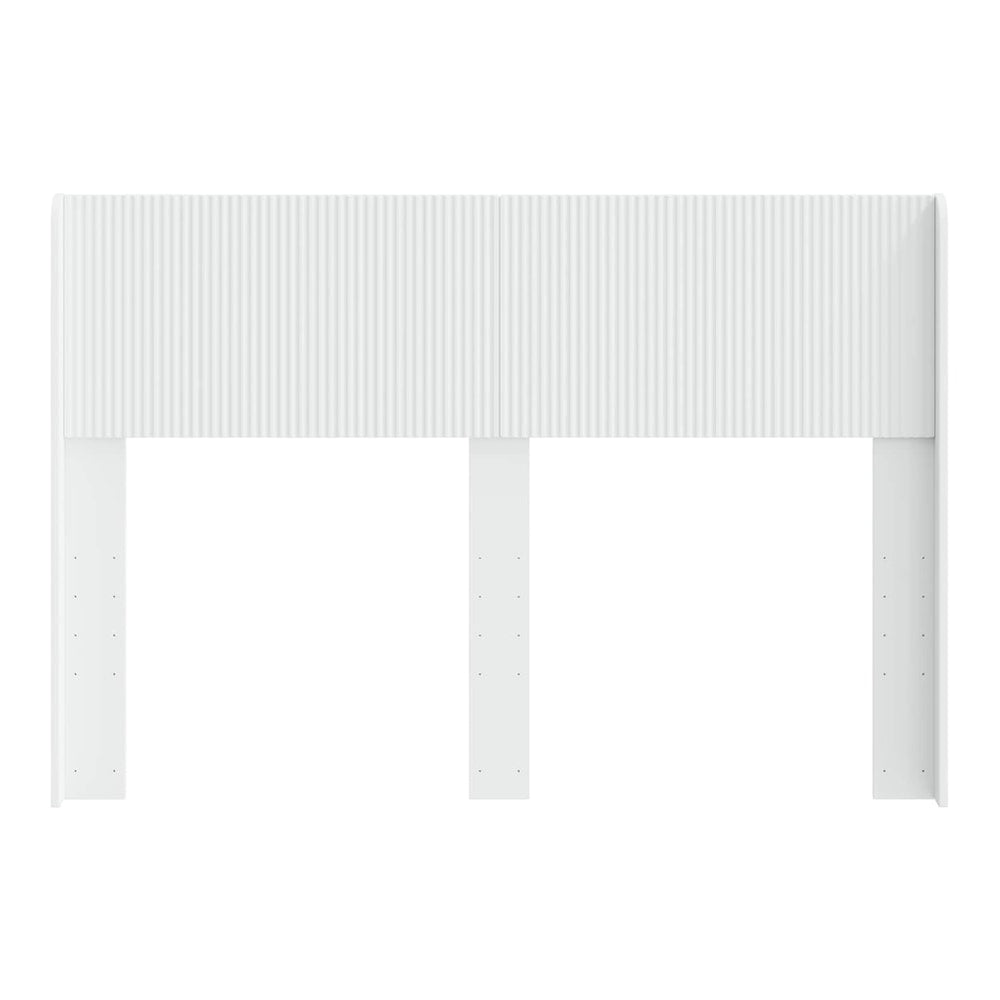 The white headboard standing alone, showing its structure and attachment points