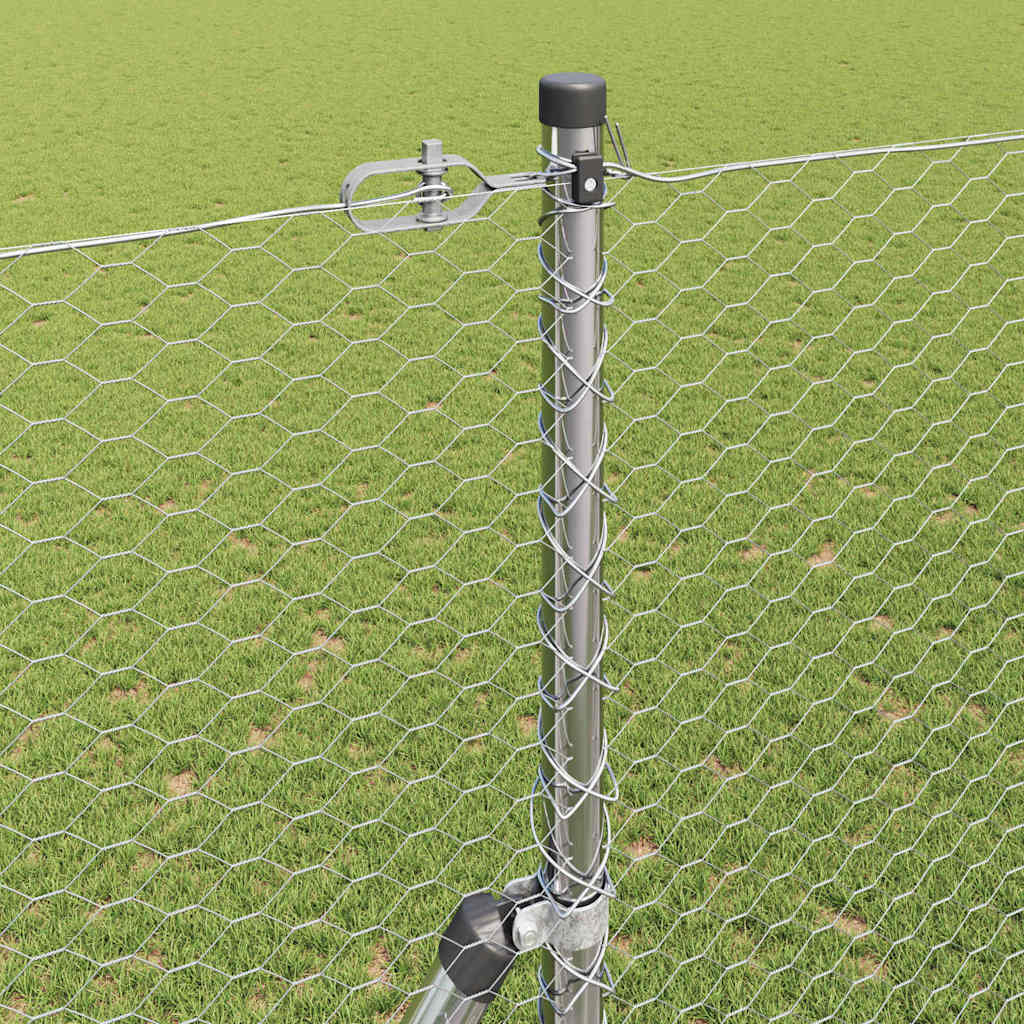 Close-up of a fence post with wire mesh attached using clips