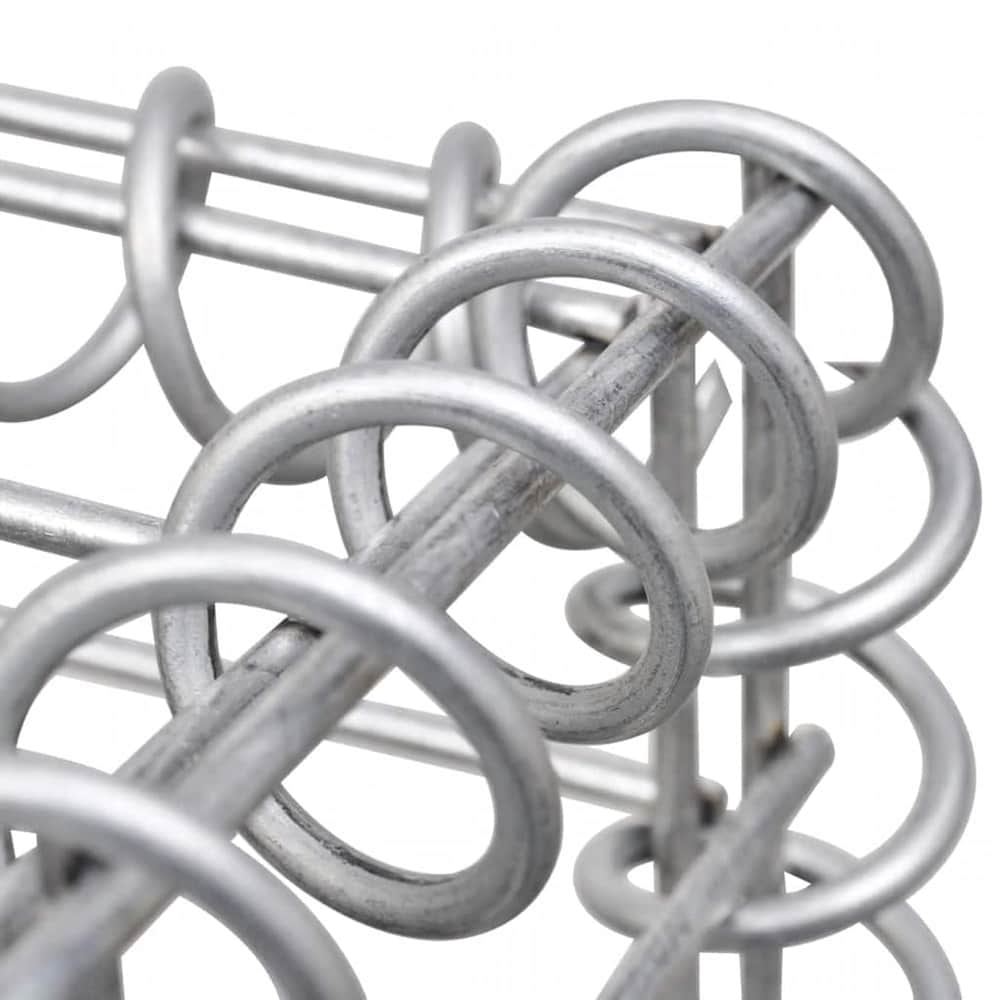 Close-up of the interlocking metal rings forming the gabion planter structure