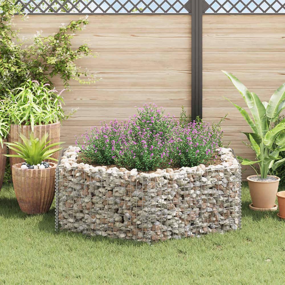 Gabion raised planter filled with soil and plants, situated outdoors
