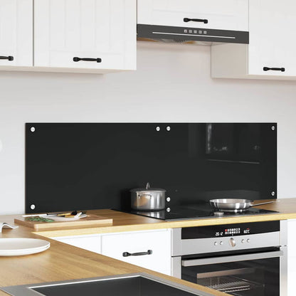 Black tempered glass kitchen backsplash fitted behind a hob and sink