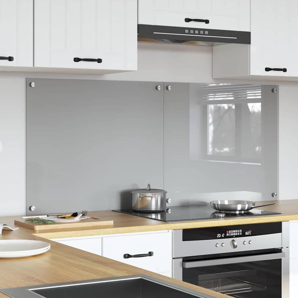 Light grey tempered glass kitchen backsplash fitted behind a hob and sink
