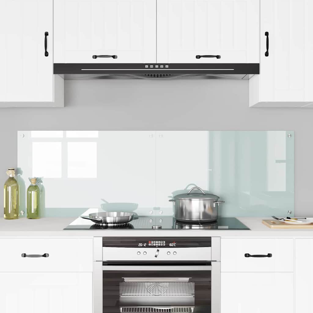 the kitchen backsplash panels mounted on a wall above a hob with cooking pots and pans