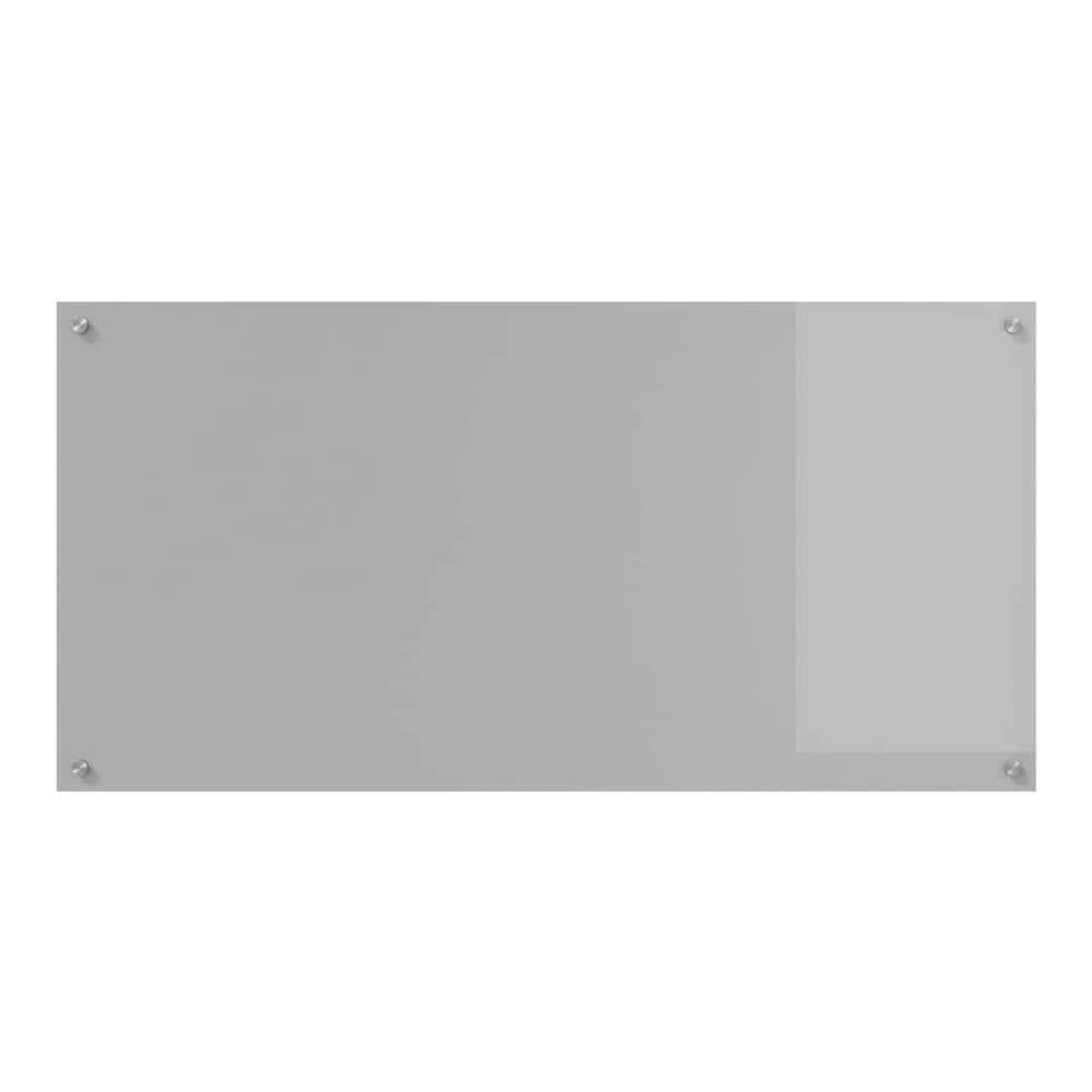 A light grey tempered glass kitchen backsplash with a slightly lighter rectangular area on the right