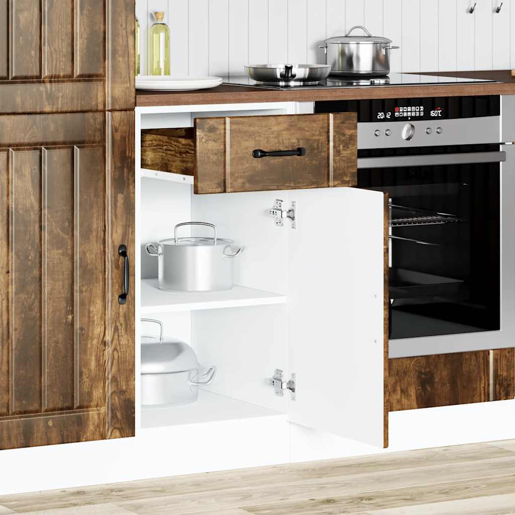 Open kitchen base cabinet showing shelves and a drawer