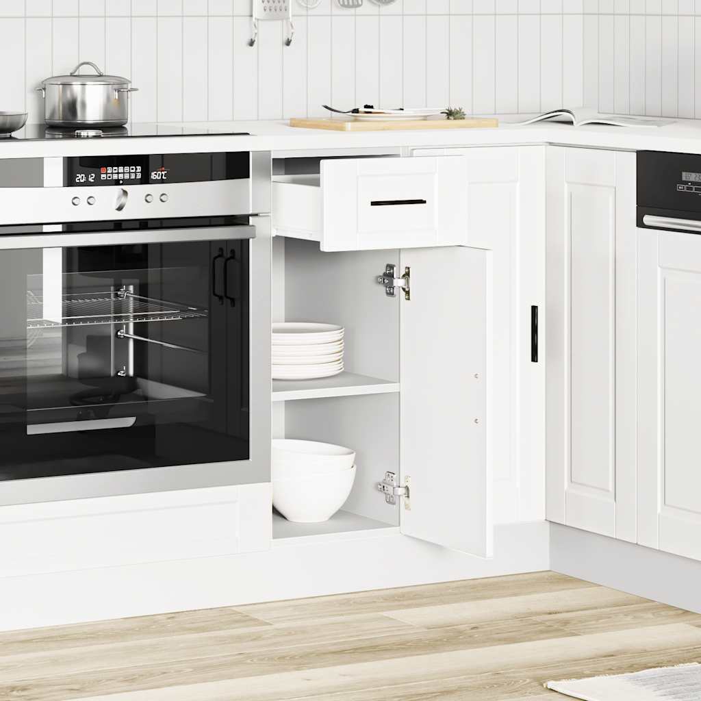 The white kitchen cabinet in a modern kitchen, with the drawer and door open showing storage space
