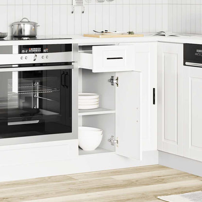 The white kitchen cabinet in a modern kitchen, with the drawer and door open showing storage space