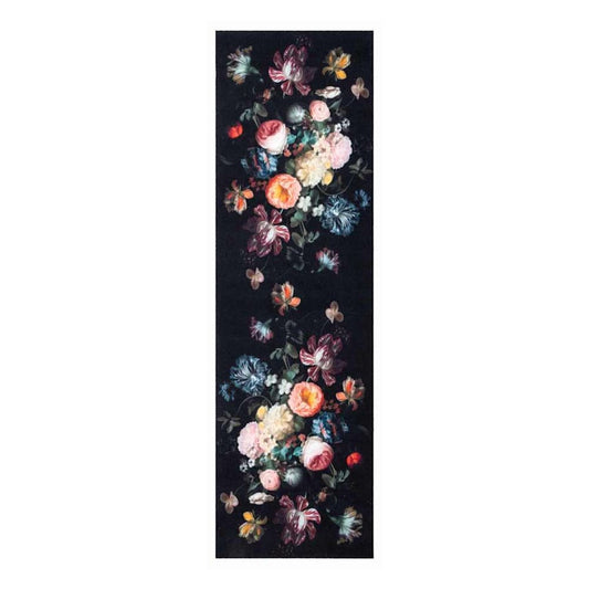 Close-up of the floral pattern on the black kitchen rug