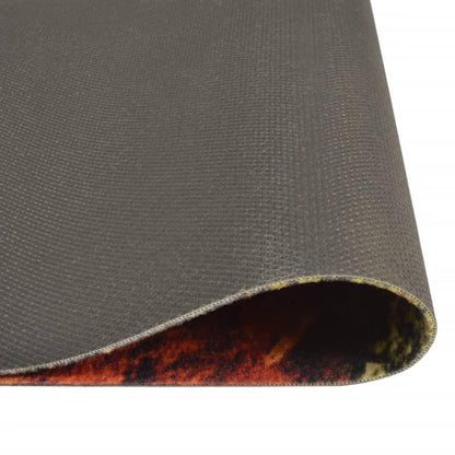 The underside of the kitchen rug, showing its grey non-slip backing