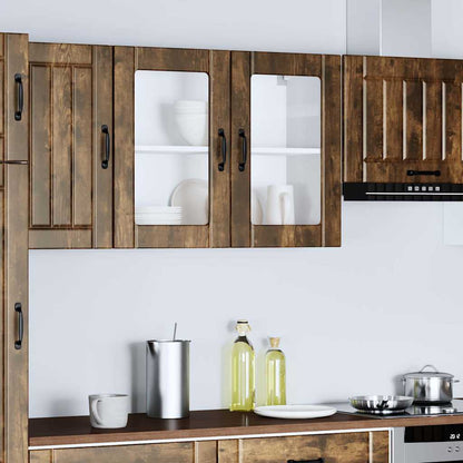 the kitchen wall cabinet installed between other wooden cabinets above a kitchen counter