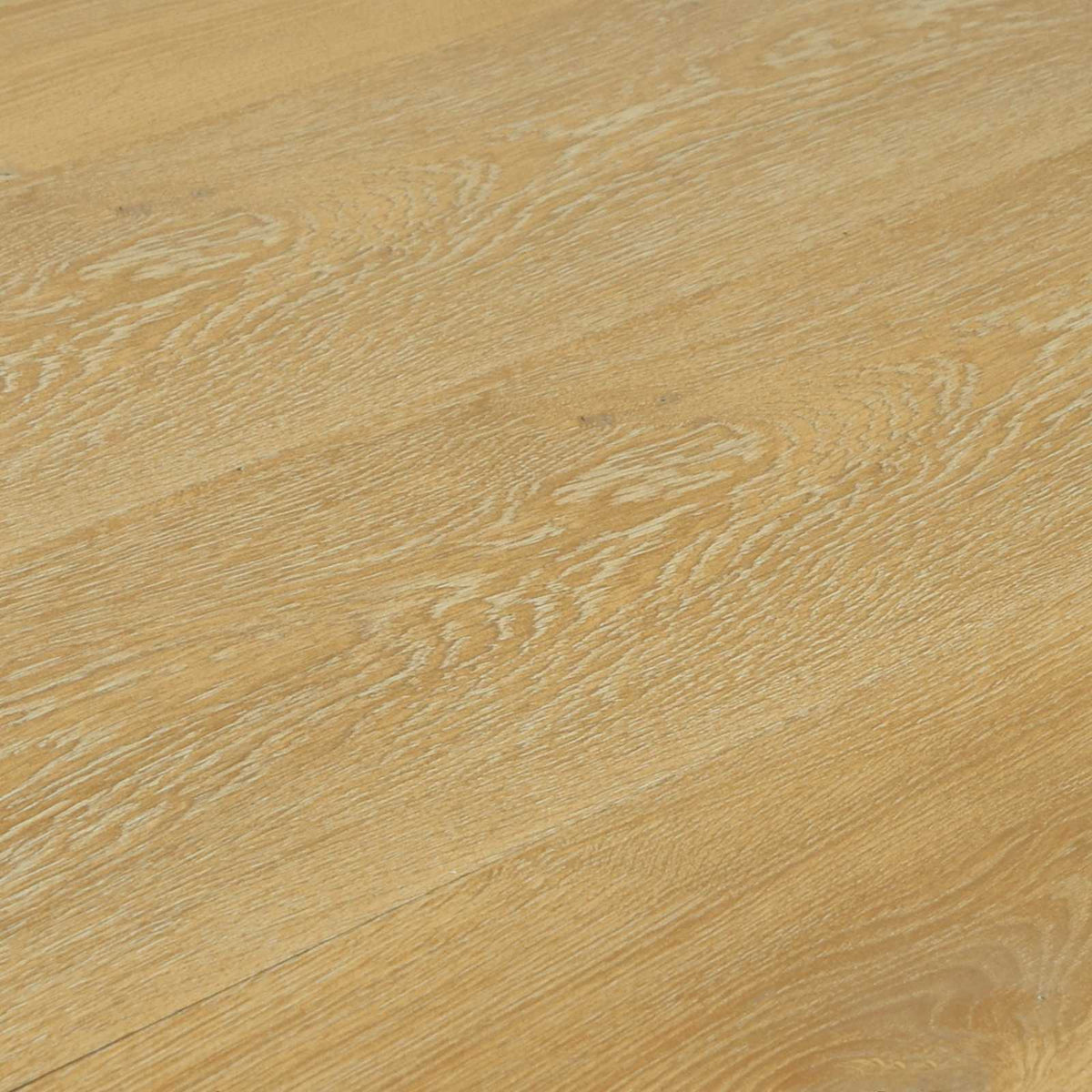 The laminate flooring surface showing a detailed view of the natural wood grain pattern