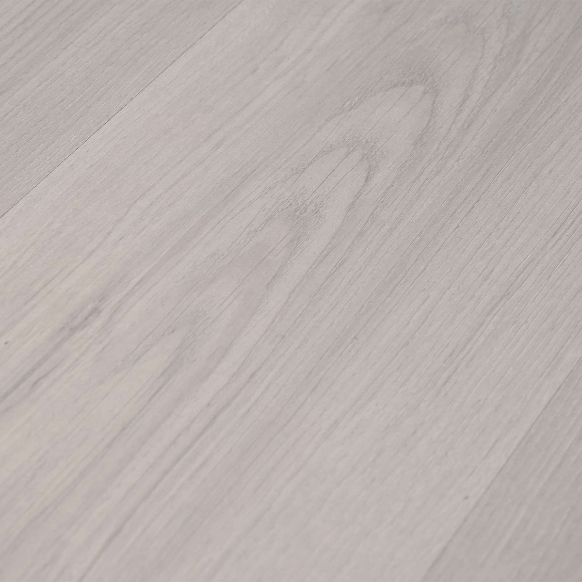the laminate flooring surface texture with visible light blue wood grain patterns