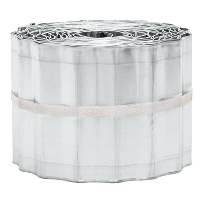 the lawn edging presented as a tightly wound roll of silver corrugated metal