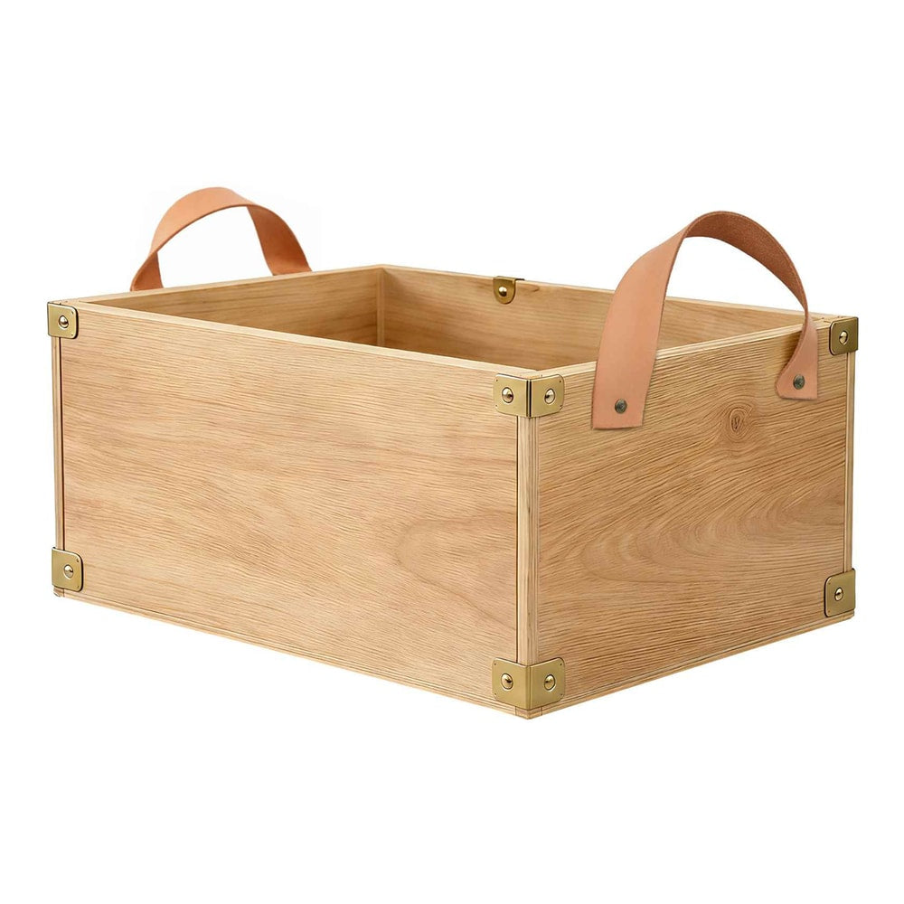 A wooden box with two light brown leather straps as handles