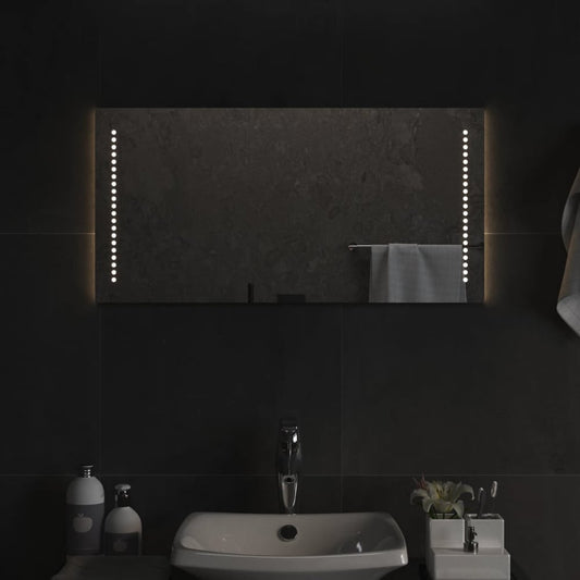 vidaXL LED Bathroom Mirror mounted horizontally above a sink in a dark tiled bathroom