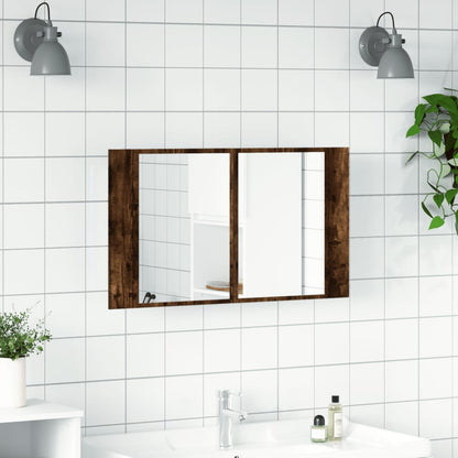 Smoked oak bathroom vanity unit with mirrored doors above a sink