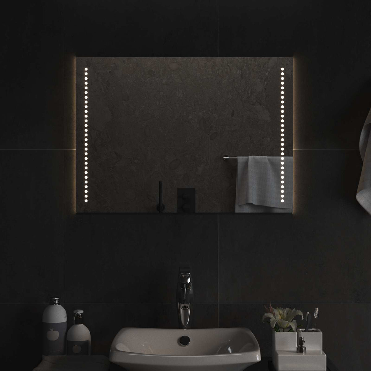 The LED bathroom mirror in a dark bathroom setting with lights on