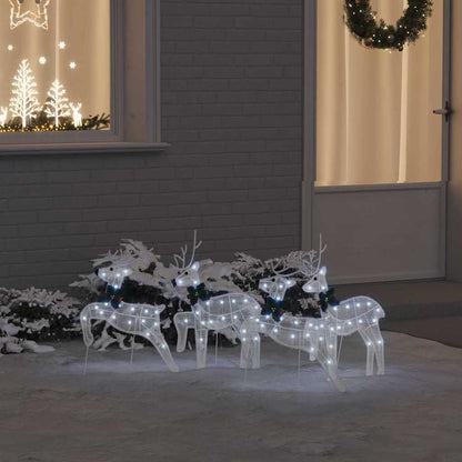 vidaXL LED Reindeers 4 pcs White Fabric displayed on a snowy lawn in front of a house at night