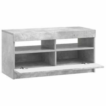 Concrete grey engineered wood TV cabinet with two open compartments and a drop-down door