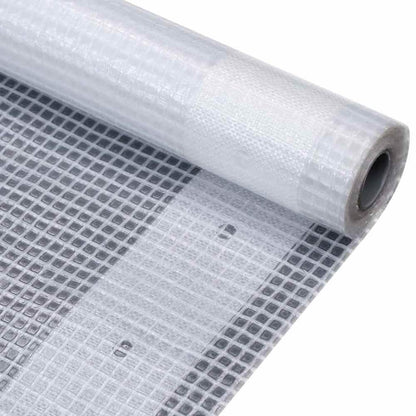 A white tarpaulin rolled up, showing the woven texture
