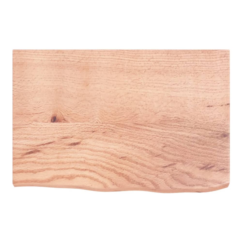 The wooden worktop viewed from directly above showing the wood grain and wavy front edge