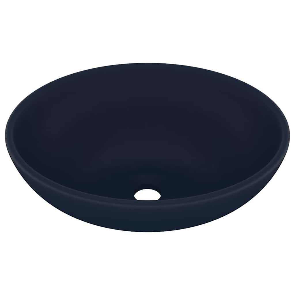 The bathroom basin shown from a high angle to reveal the interior and the drain hole