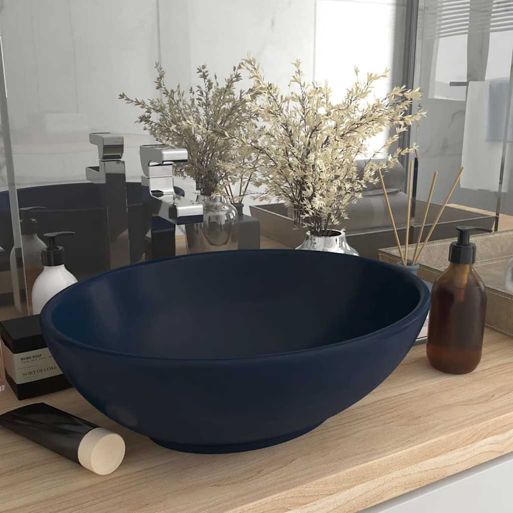 Luxury Basin Oval-shaped Matt Dark Blue placed on a wooden vanity unit in a modern bathroom