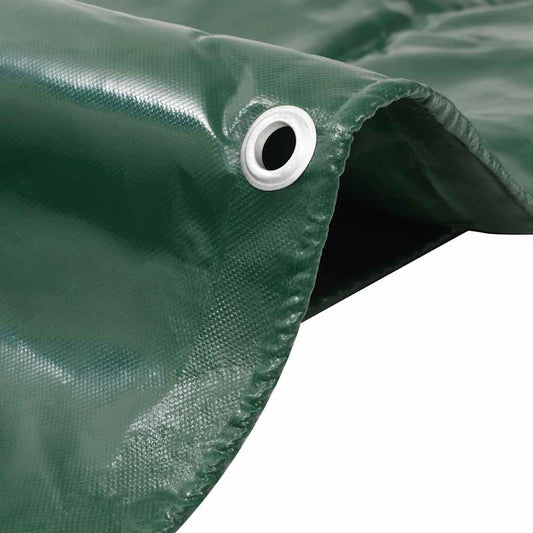Close-up green tarpaulin showing metal eyelet