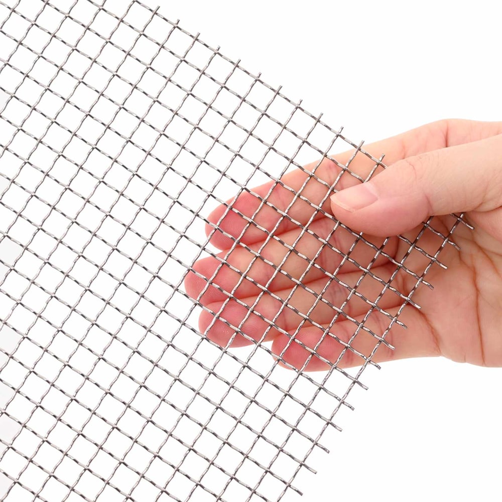 A hand holding a section of the stainless steel mesh screen