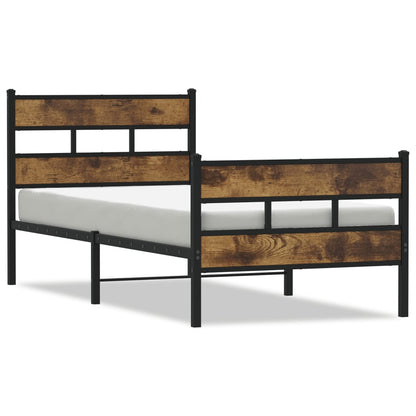 The metal bed frame with a mattress placed on top showing the headboard and footboard