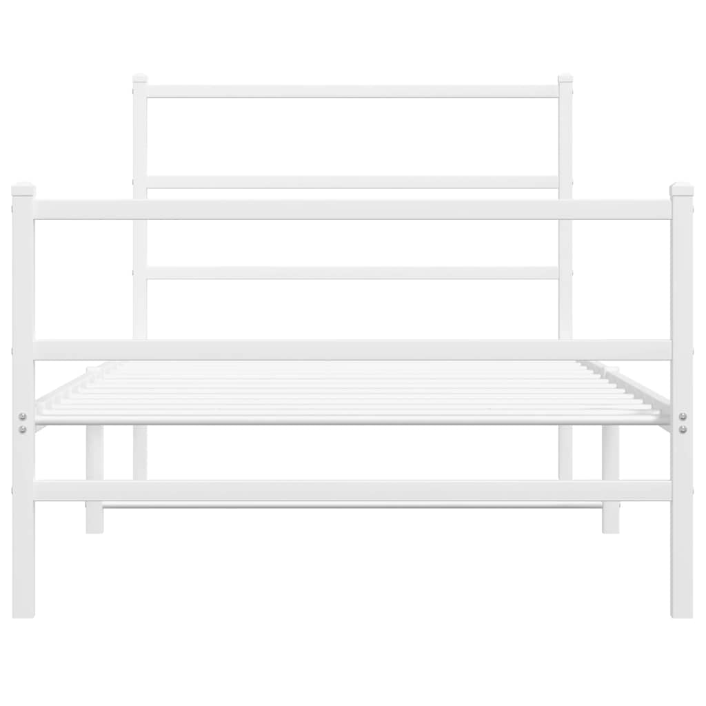 Close-up of the white metal bed frame's headboard and side rails