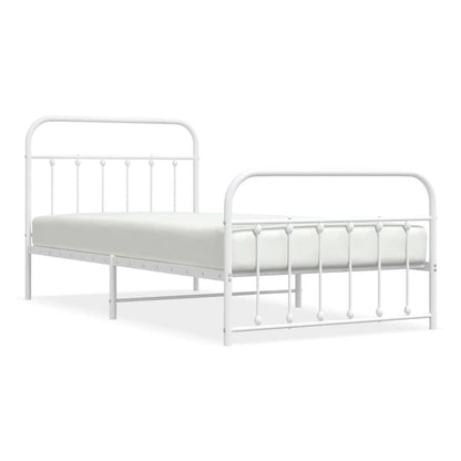 White metal bed frame with a mattress, showing the headboard and footboard detail