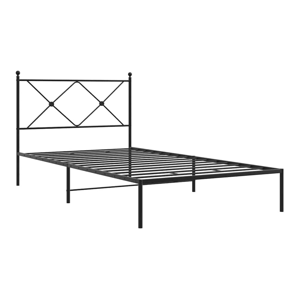The black metal bed frame without a mattress, showing the headboard detail