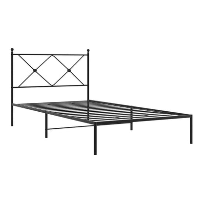 The black metal bed frame without a mattress, showing the headboard detail