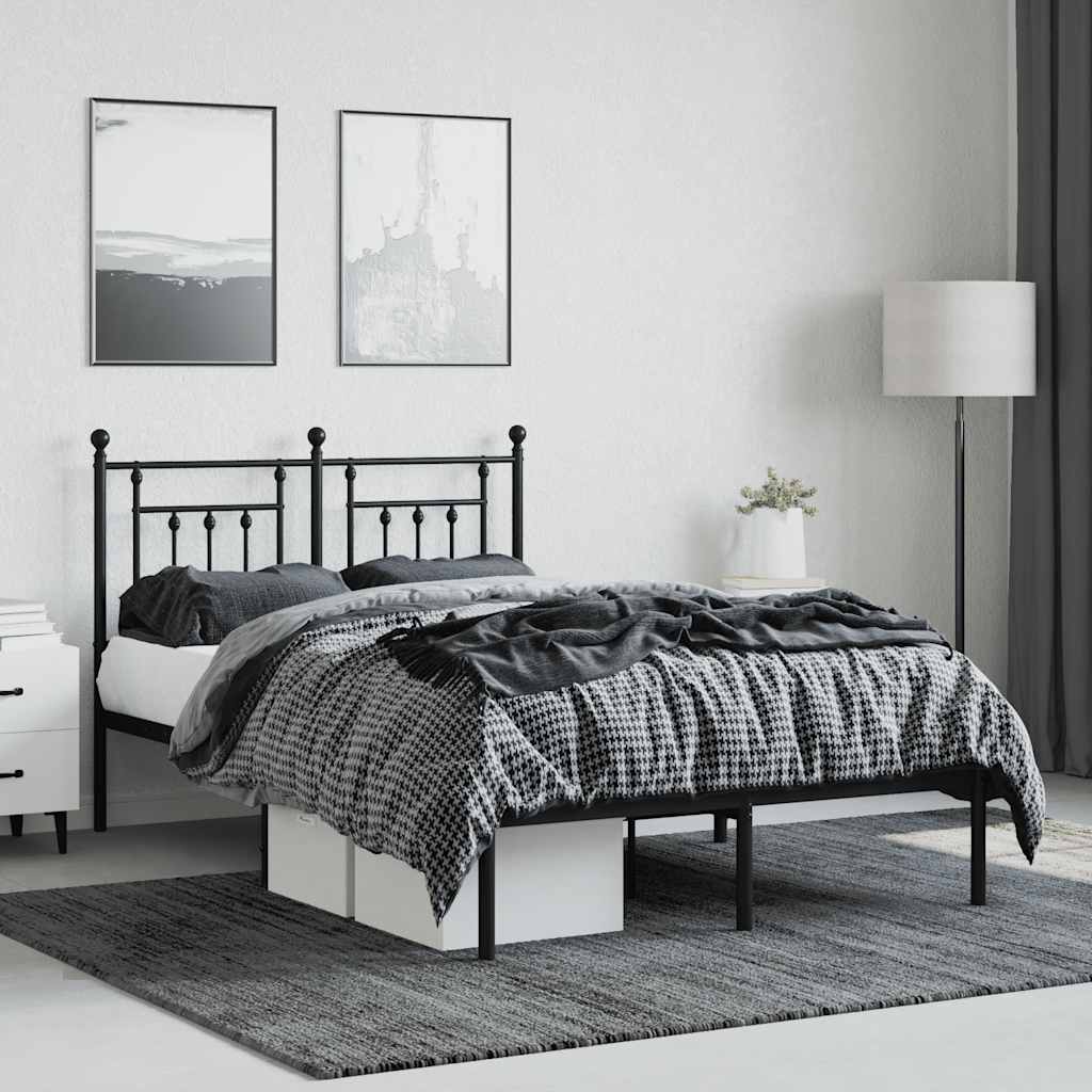 black metal bed frame with headboard and footboard, made up with bedding