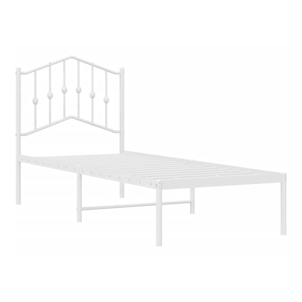 white metal bed frame with a decorative headboard and no mattress