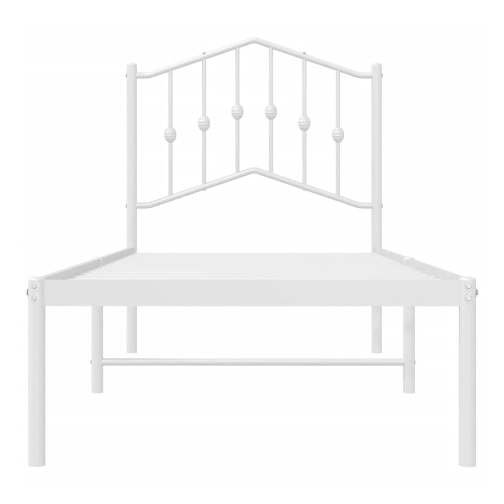 white metal bed frame with a decorative headboard viewed from the front