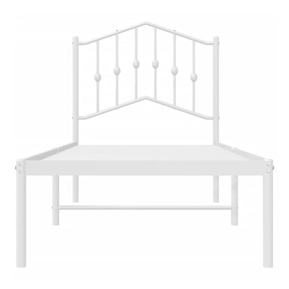 white metal bed frame with a decorative headboard viewed from the front