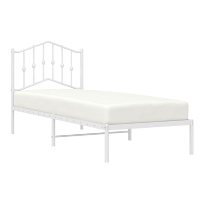 White metal bed frame with a headboard and mattress, side view