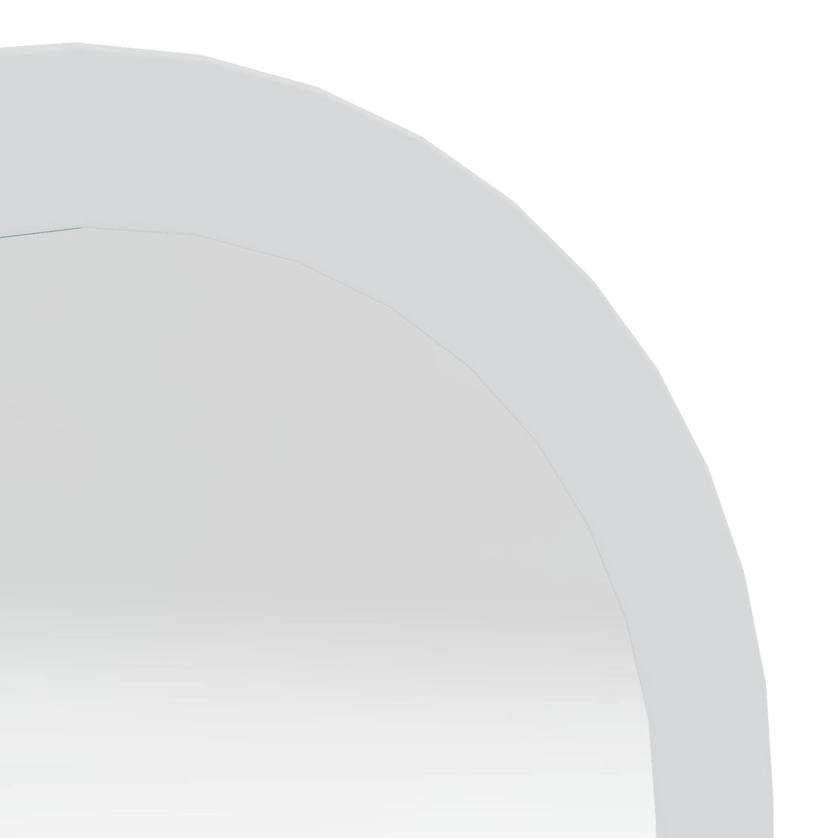 Close-up of the white frame and curved top of the arched mirror
