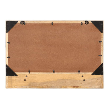 The back of the mirror showing the wooden frame and mounting hardware